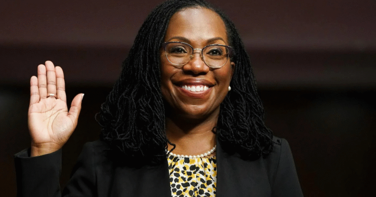 Justice Ketanji Brown Jackson at the Supreme Court steps, a portrait of judicial breakthrough and partnership.